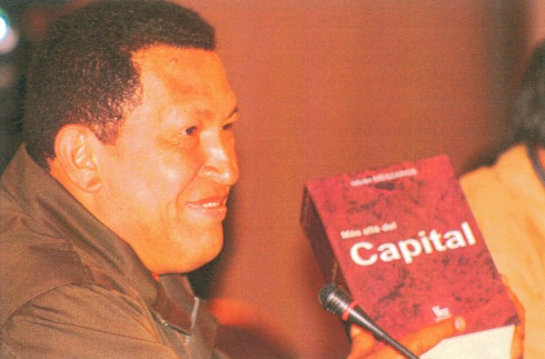 Hugo Chávez, former president of Venezula, holding the Spanish edition of Beyond Capital by István Mészáros