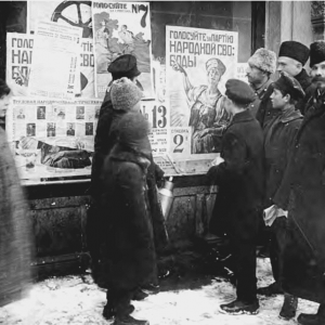 Petrograders examine campaign posters for elections to the Constituent Assembly