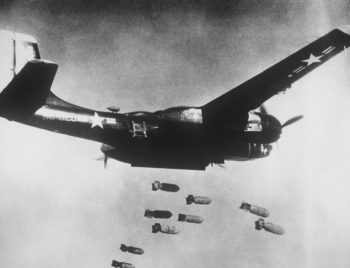 A black painted U.S. Air Force Douglas B-26C Invader dropping bombs during the Korean War in 1953